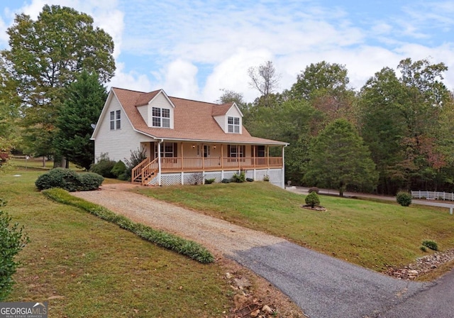 view of front of home with a porch and a front yard