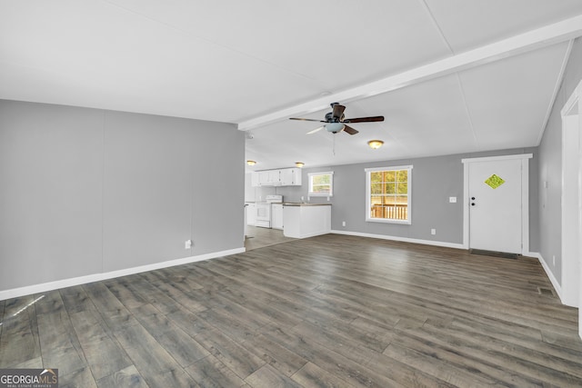 unfurnished living room with ceiling fan, dark hardwood / wood-style floors, and lofted ceiling with beams