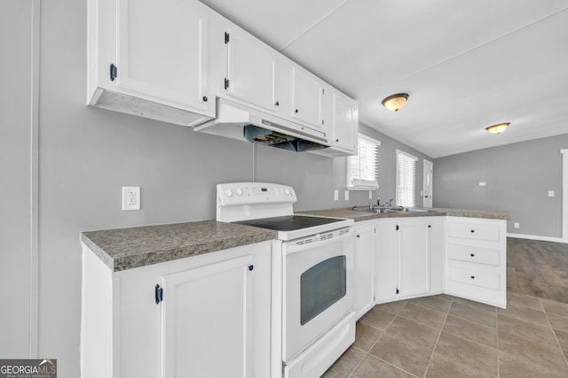 kitchen with light tile patterned floors, white cabinets, sink, and white electric stove