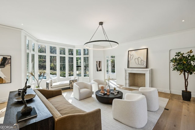 living room featuring light wood-type flooring and crown molding