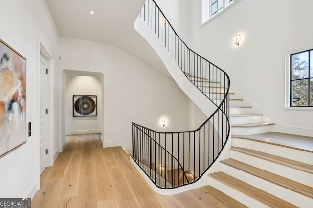 stairs with wood-type flooring