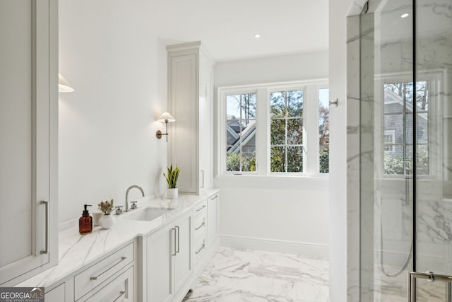 bathroom with vanity and a tile shower