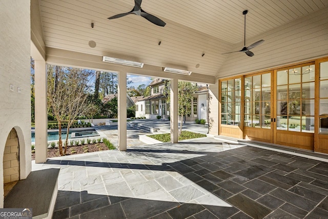 view of patio featuring french doors and ceiling fan