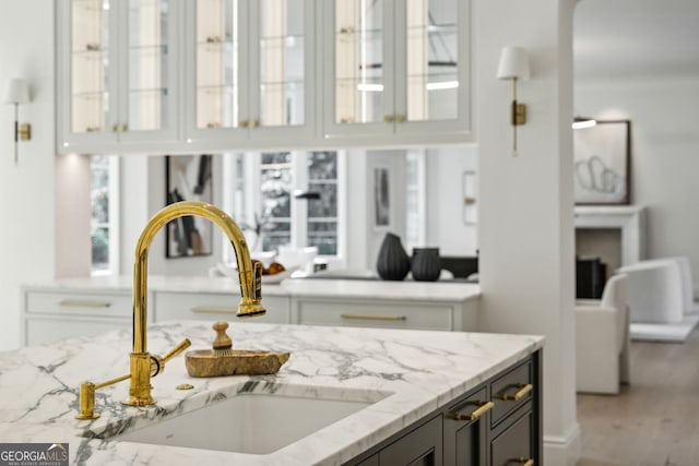 interior details with light stone counters and sink