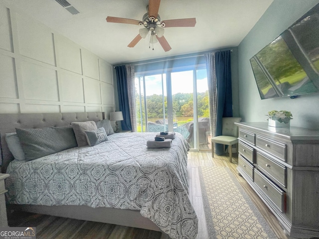 bedroom with hardwood / wood-style flooring and ceiling fan