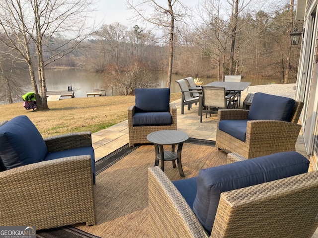 view of patio / terrace featuring outdoor lounge area and a water view