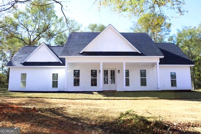 back of house with a lawn