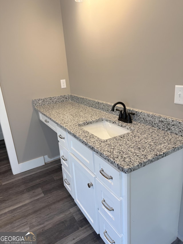 bathroom featuring vanity and hardwood / wood-style floors