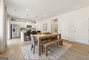 dining room featuring light hardwood / wood-style flooring