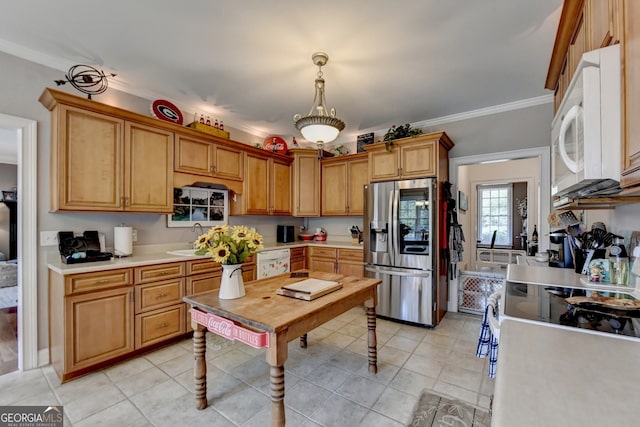 kitchen with pendant lighting, white appliances, sink, ornamental molding, and light tile patterned floors