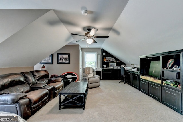 carpeted bedroom featuring ceiling fan and vaulted ceiling