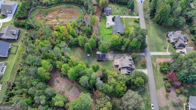 view of patio / terrace featuring a garage and an outbuilding