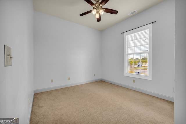 carpeted empty room with ceiling fan