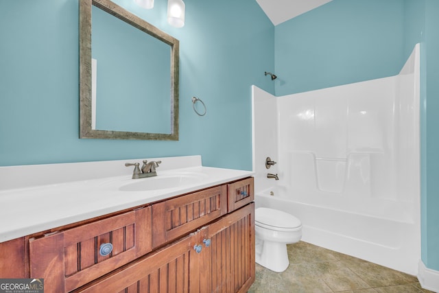 full bathroom with washtub / shower combination, tile patterned flooring, vanity, and toilet