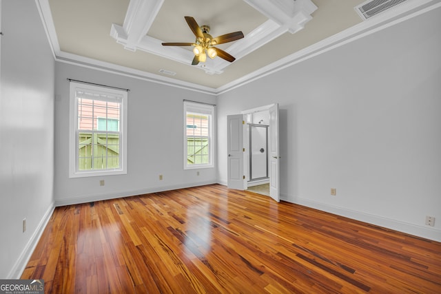 spare room with ornamental molding, ceiling fan, plenty of natural light, and light hardwood / wood-style flooring