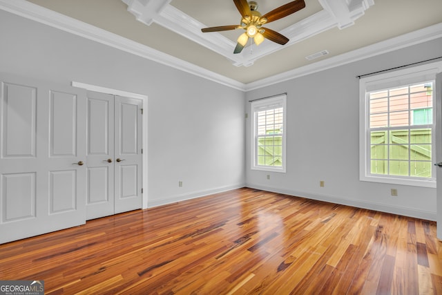 unfurnished bedroom with coffered ceiling, light wood-type flooring, crown molding, and ceiling fan