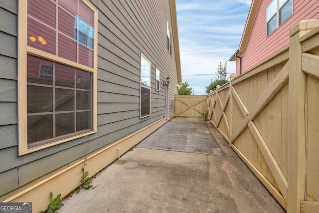 view of side of property with a patio area