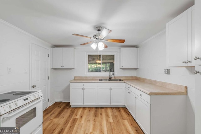 kitchen with light hardwood / wood-style floors, white cabinets, electric stove, and sink