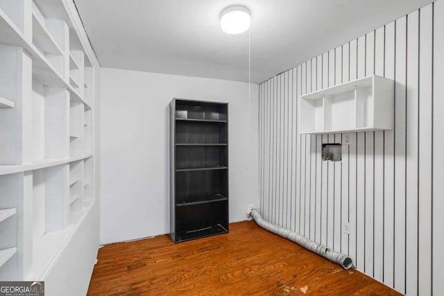 interior space featuring built in features and hardwood / wood-style flooring