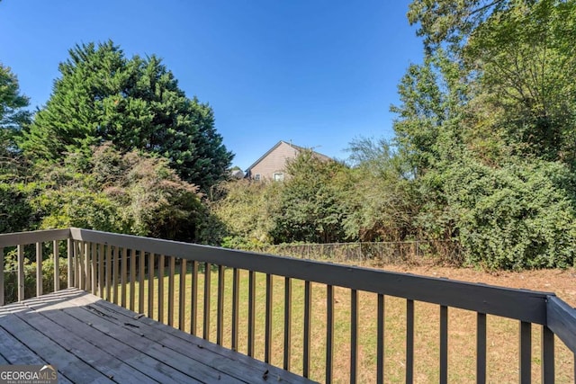 deck featuring a lawn