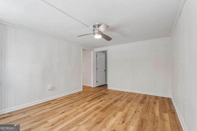 spare room with ornamental molding, ceiling fan, and light hardwood / wood-style floors