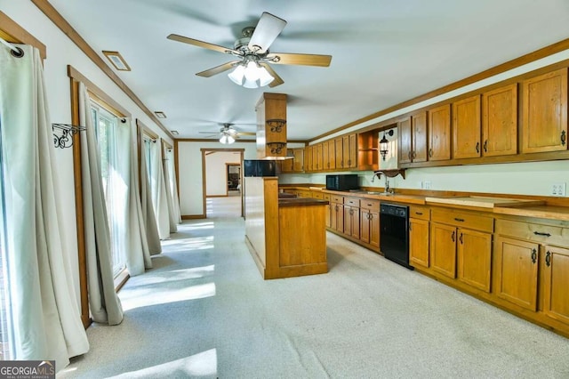 kitchen featuring ceiling fan, crown molding, black dishwasher, sink, and a center island