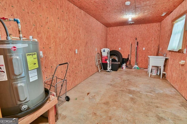 interior space with water heater and concrete flooring