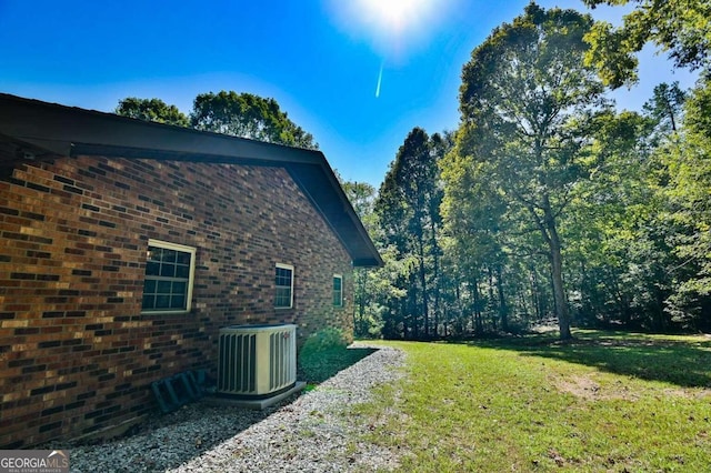 view of yard featuring central AC unit