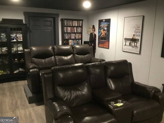 cinema featuring hardwood / wood-style flooring