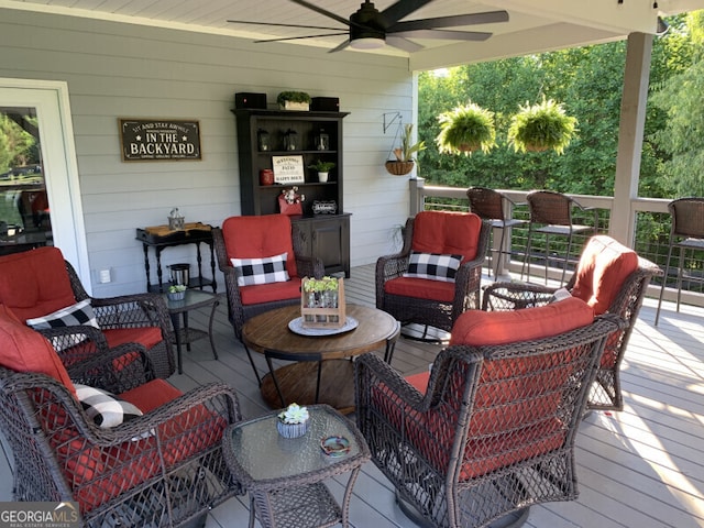 wooden deck featuring ceiling fan