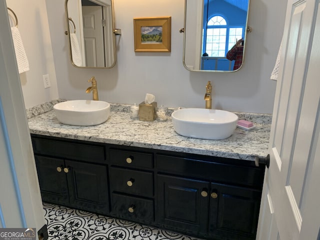 bathroom featuring tile patterned floors and vanity