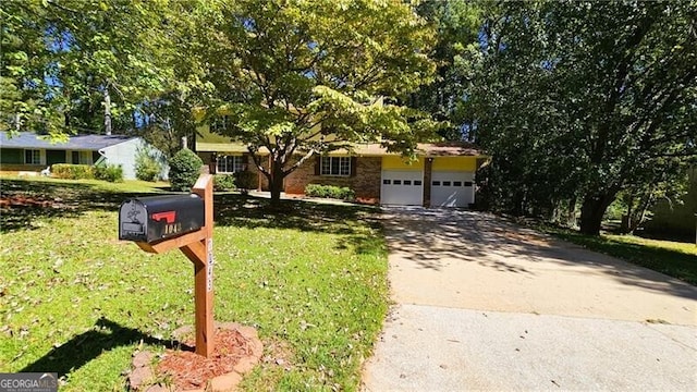 view of front of home with a front lawn and a garage