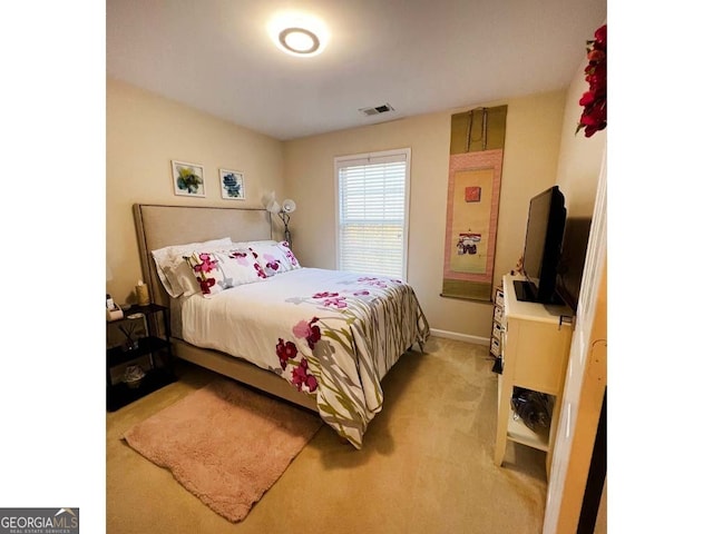 bedroom with light carpet