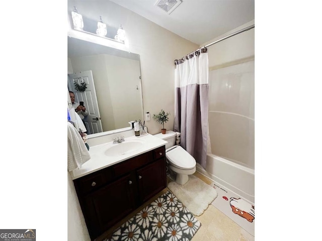 full bathroom featuring tile patterned flooring, shower / bath combo, vanity, and toilet