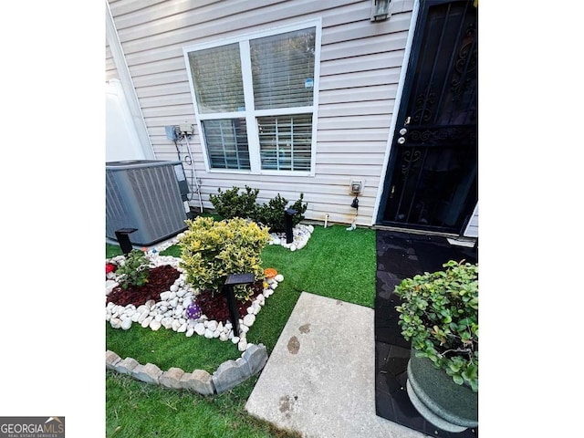 view of yard featuring central AC unit