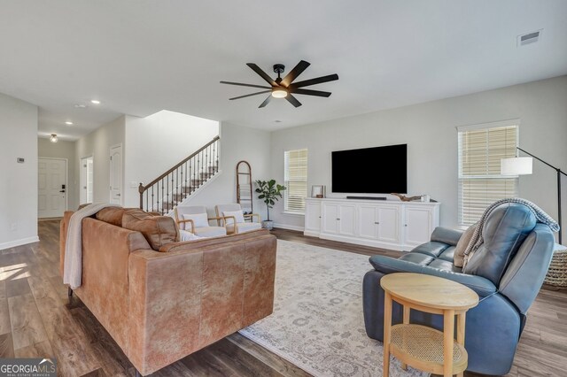 22 Allston Ln, Savannah, GA 31407 - living area featuring visible vents, dark wood-type flooring, stairs, and ceiling fan