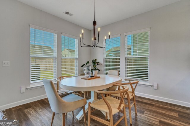 22 Allston Ln, Savannah, GA 31407 - dining room featuring an inviting chandelier, baseboards, visible vents, and dark wood-type flooring