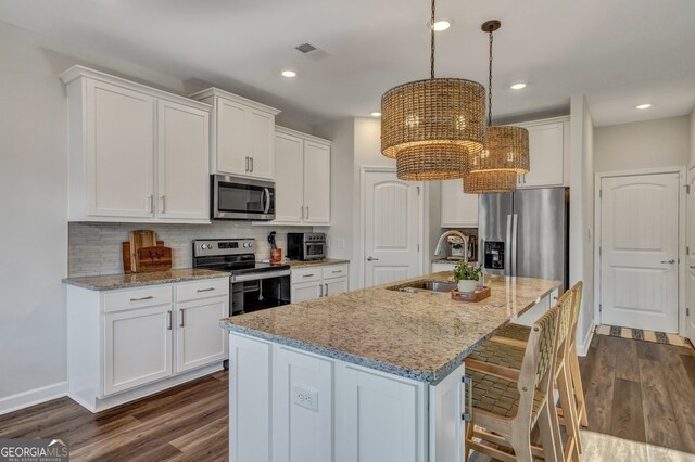 22 Allston Ln, Savannah, GA 31407 - kitchen featuring dark wood-type flooring, white cabinetry, a sink, appliances with stainless steel finishes, and backsplash