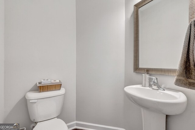 22 Allston Ln, Savannah, GA 31407 - bathroom featuring baseboards and toilet