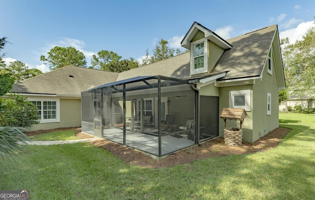 233 Cardinal Cir W, Saint Marys, GA 31558 - rear view of property with a lawn, a shingled roof, a lanai, and stucco siding