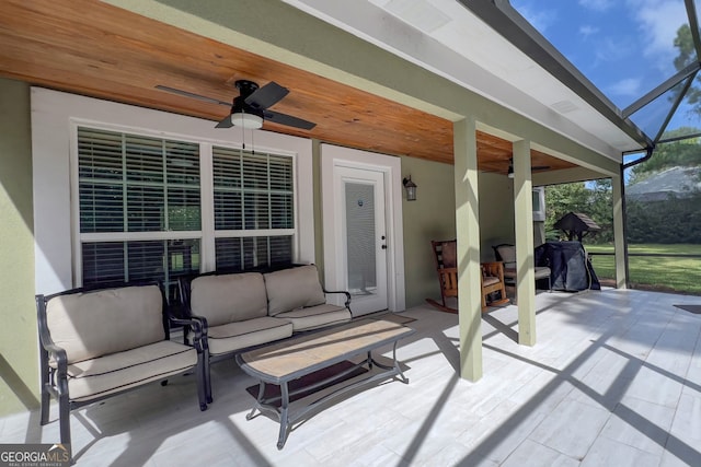 view of patio with outdoor lounge area, a lanai, and ceiling fan