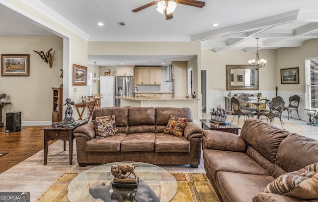 233 Cardinal Cir W, Saint Marys, GA 31558 - living area featuring light wood-style floors, ceiling fan with notable chandelier, beamed ceiling, visible vents, and ornamental molding