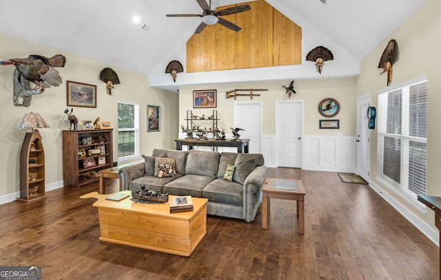 living room with ceiling fan, dark hardwood / wood-style flooring, and high vaulted ceiling