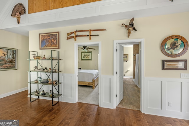 corridor with hardwood / wood-style floors