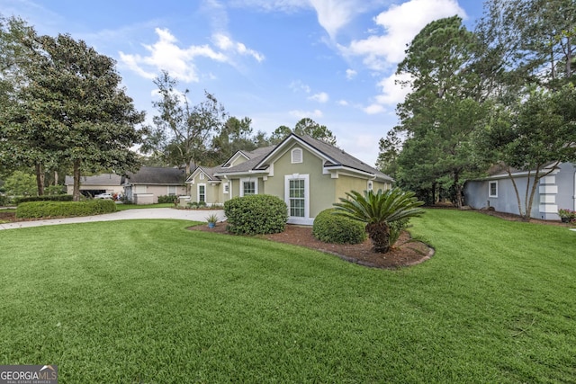 233 Cardinal Cir W, Saint Marys, GA 31558 - ranch-style home featuring stucco siding, concrete driveway, and a front yard