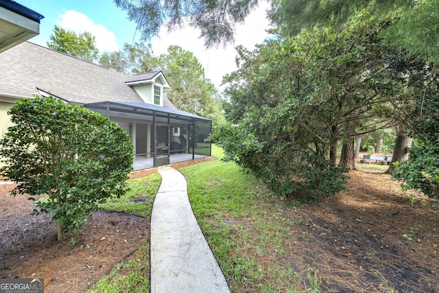 view of yard featuring a sunroom