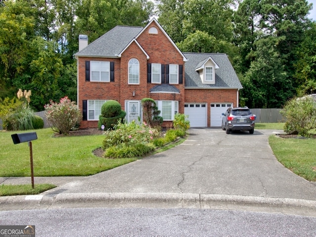 view of front facade featuring a garage and a front lawn