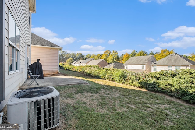 view of yard featuring a patio area and central AC