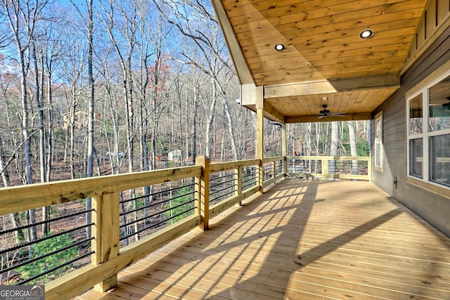 wooden terrace featuring ceiling fan