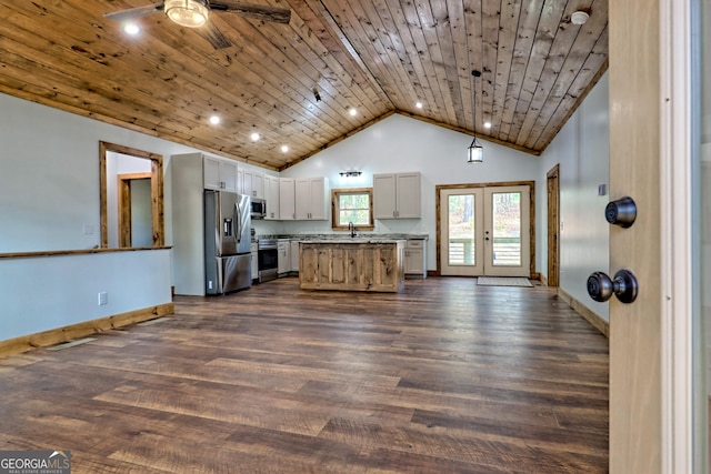 kitchen featuring dark wood-type flooring, a kitchen island, wood ceiling, and appliances with stainless steel finishes